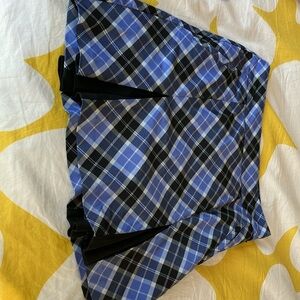 IZOD Golf skort, pleated plaid skirt w black shorts. Size 2.
